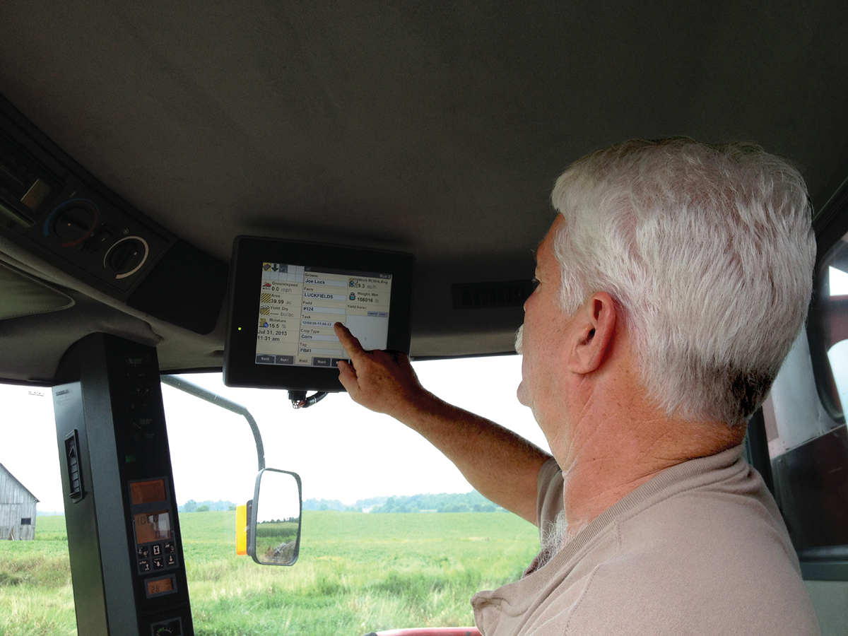 Farmer Joe Dan Luck reviews yield monitor settings. Photo courtesy of Joe David Luck.