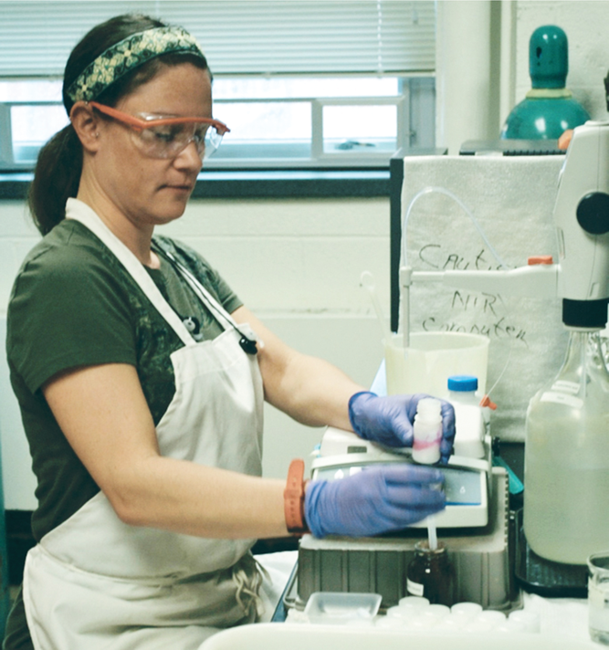 Lab technician, Erin Silva, prepares a sample for titration with hydrochloric acid to determine the amount of CO2 released by soil during incubation as part of soil-test biological activity to predict soil nitrogen mineralization. Photo by Alan Franzluebbers, USDA-ARS.