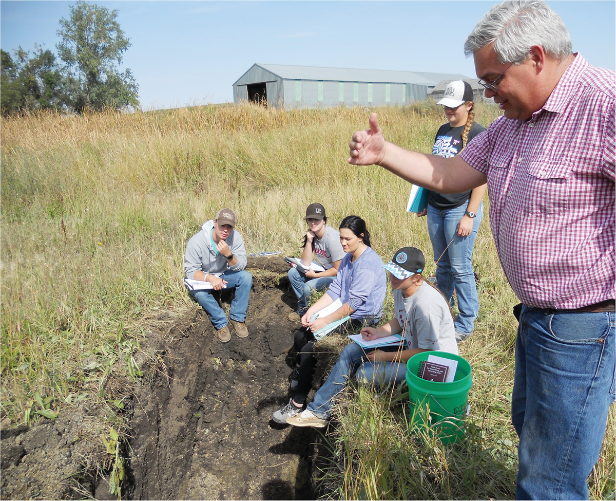 Dickinson State University students learn to describe soils in the field in 2018. Photo by Cindy Burgess, Dickinson State University.