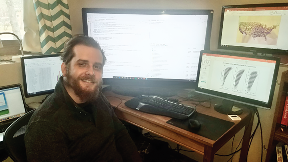 Nick Ames analyzing DNA and field-performance data to determine how genomewide predictions can reduce field testing in maize.