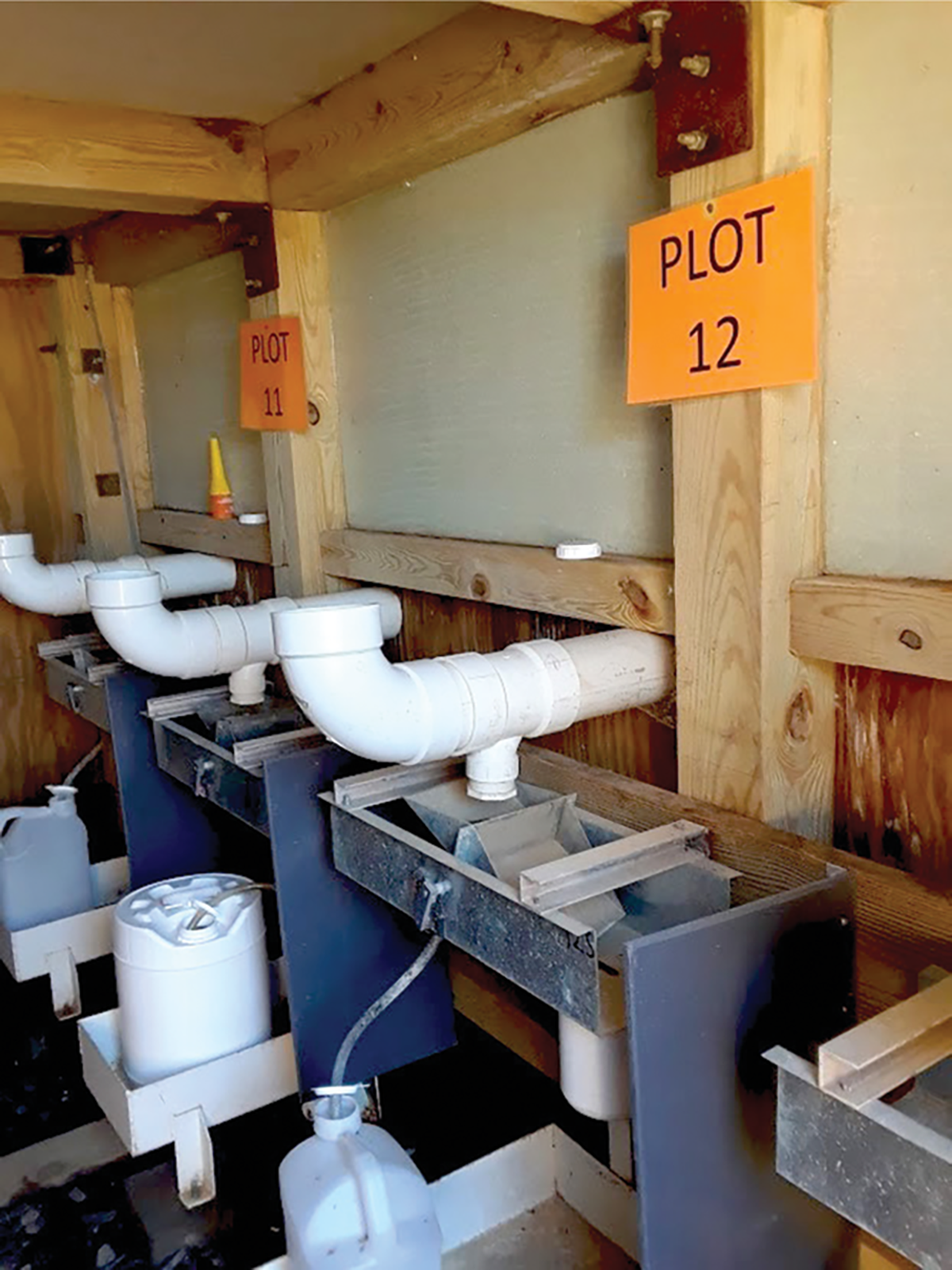 Tipping buckets used to measure runoff from lysimeter plots. Photo by Sarah Frame.