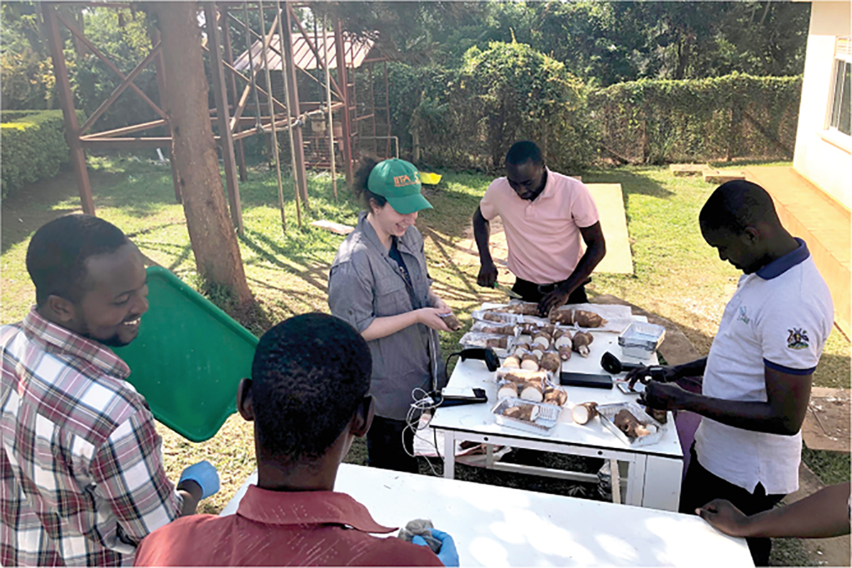 Jenna Hershberger interacts with students and plant breeders at the Uganda National Crops Resources Research Institute. Photo courtesy of Jenna Hershberger.