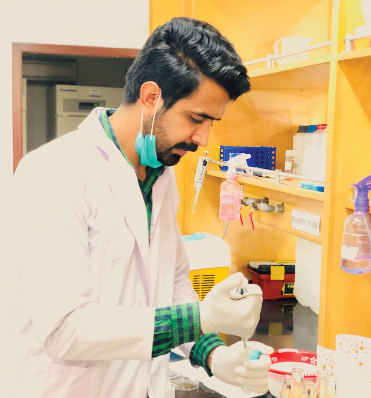 Usman Zulfiqar, Ph.D. student and lead author of the study, working on digestion of rice grain samples for determination of grain Zn concentration. Photo by Aqib Hussain.