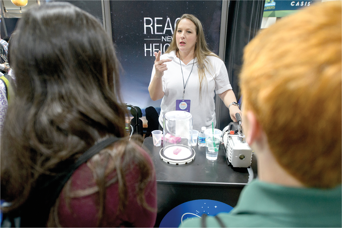 If you are fortunate enough to have colleagues who enjoy communicating science to the public, then be sure to include them in your proposals and acknowledge their efforts. Photo by NASA/Joel Kowsky.