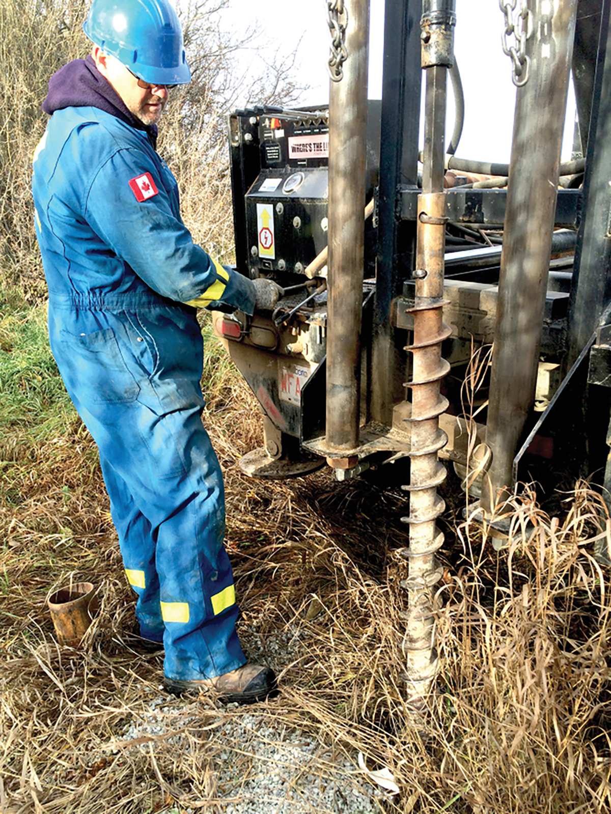 Field technician from Alberta Agriculture and Forestry decommissioning groundwater wells at a CFO site. Photo courtesy of the Government of Alberta.