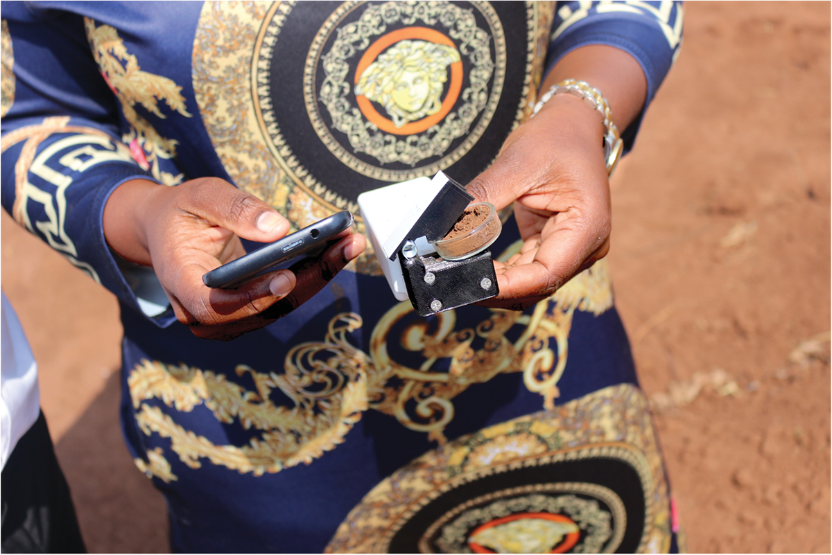 Hannah Livuza uses the reflectometer to estimate soil carbon. Photo by Regis Chikowo.