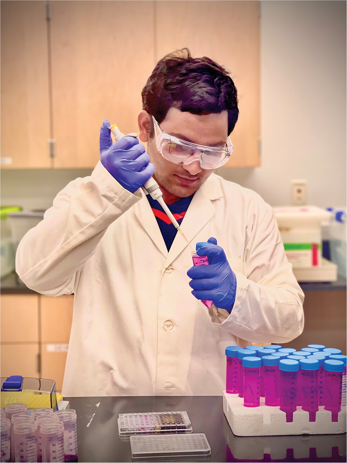 Graduate student Binaya Parajuli analyzing active carbon concentrations in soil extracts. Photo by Pratima Poudel.