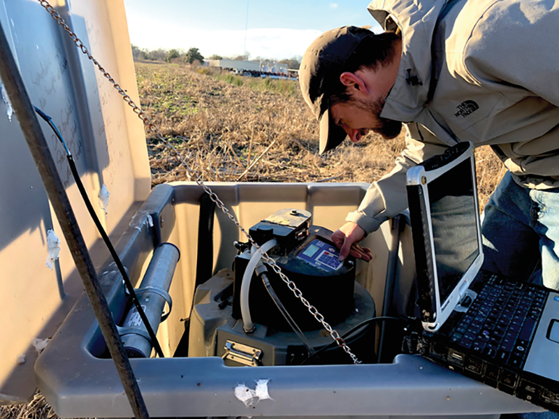 Thomas “Beau” Badon, a Mississippi State University graduate research assistant and first author on the study, prepares the sampling station to collect data from a study site in northwest Mississippi. Photo by Mark Hill.