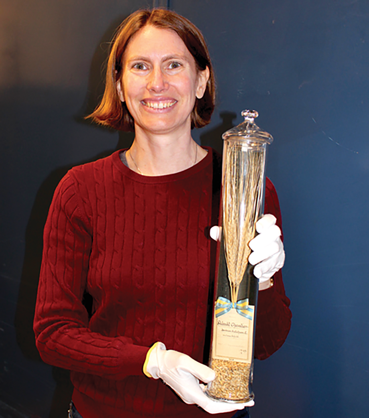 Article co-author Jenny Hagenblad with a sample of 130-year-old Chevalier grains. Photo by Per Larsson.