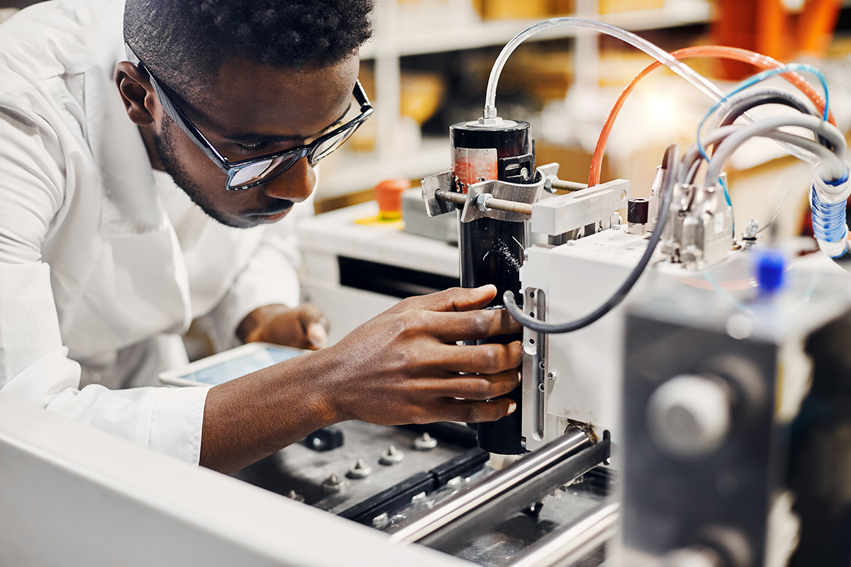 Scientist with lab machine.