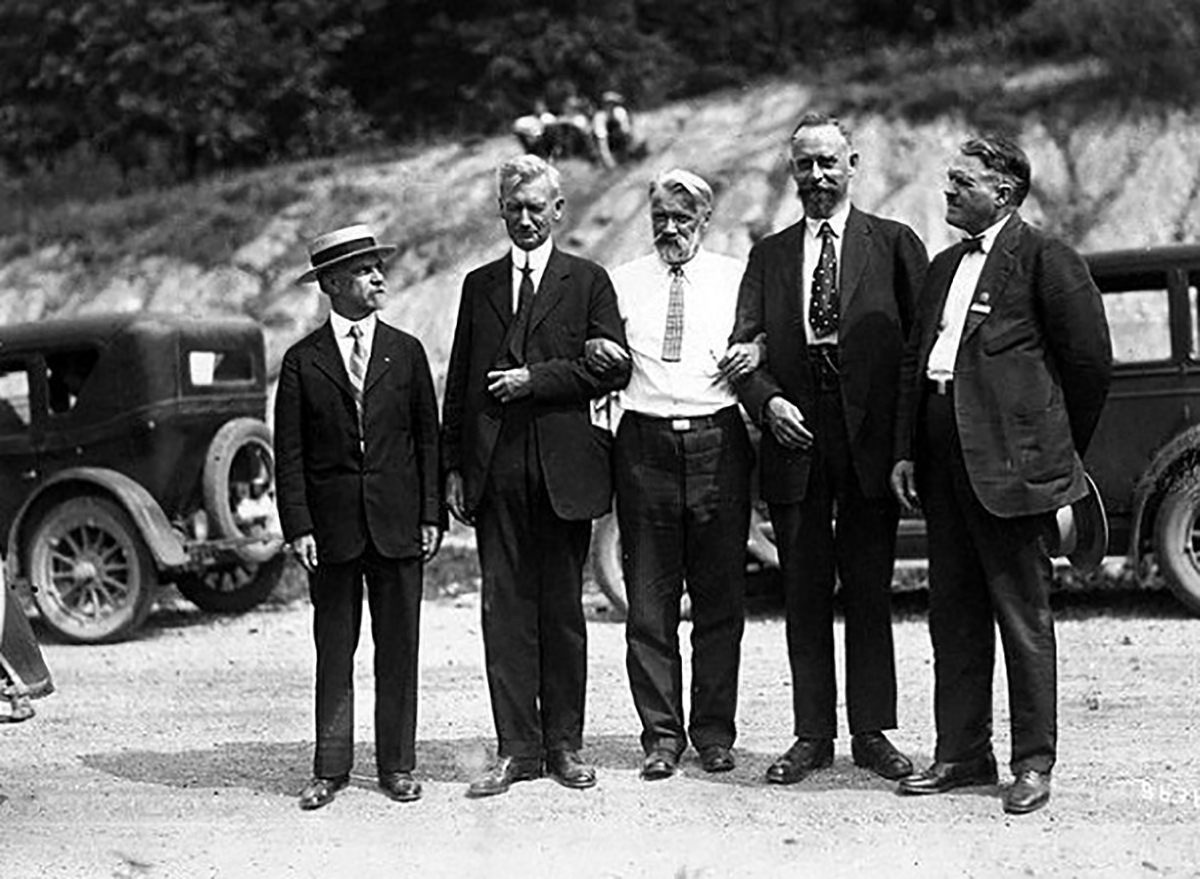 A transcontinental field tour was organized as part of the First International Congress of Soil Science, held June 13-22, 1927, in Washington, DC. This photo appears to be a field or group setting during the tour and shows Curtis F. Marbut (second from left, a U.S. pedologist who guided much of the tour) and Konstantin Glinka (middle, a soil scientist from the Soviet Union).