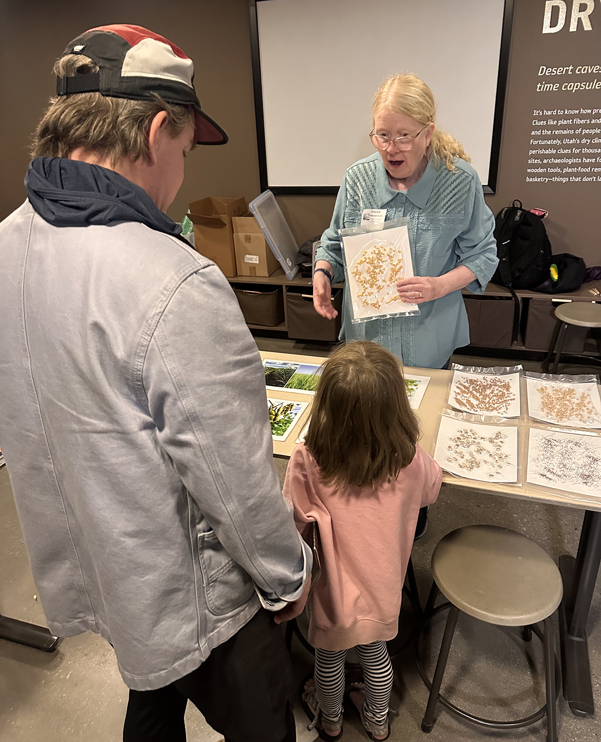 Melanie Bayles and visitors playing the "matching game" during a "Saturday With a Scientist" event. Photo by Susan Chapman.