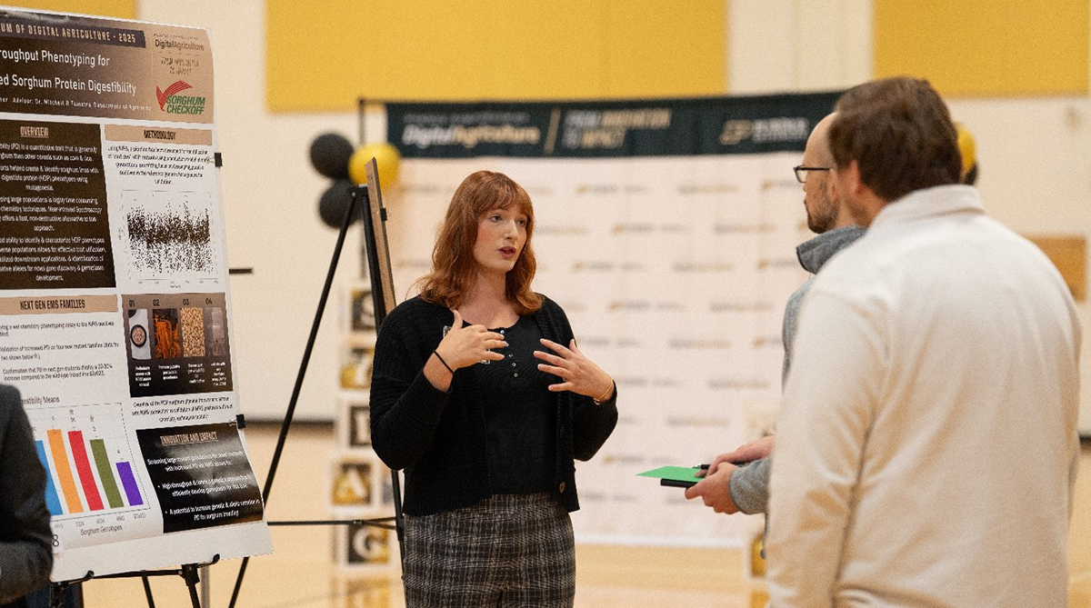 Graduate student Erin Widener presenting during the poster competition at the 2025 Symposium of Digital Agriculture at Purdue University. 