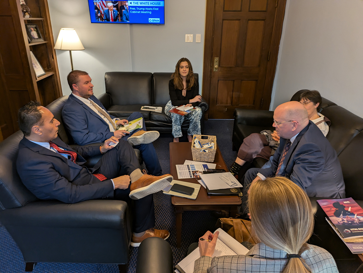 Society members meet with staff from the office of U.S. Rep. Eugene Vindman.