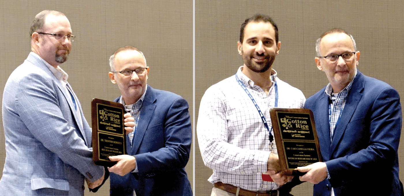 Trent Roberts (left) and Caio Vieira (right) were recognized for their conservation work in rice and soybeans at the National Conservation Systems Cotton & Rice Conference in January 2024 in Jonesboro, AR.