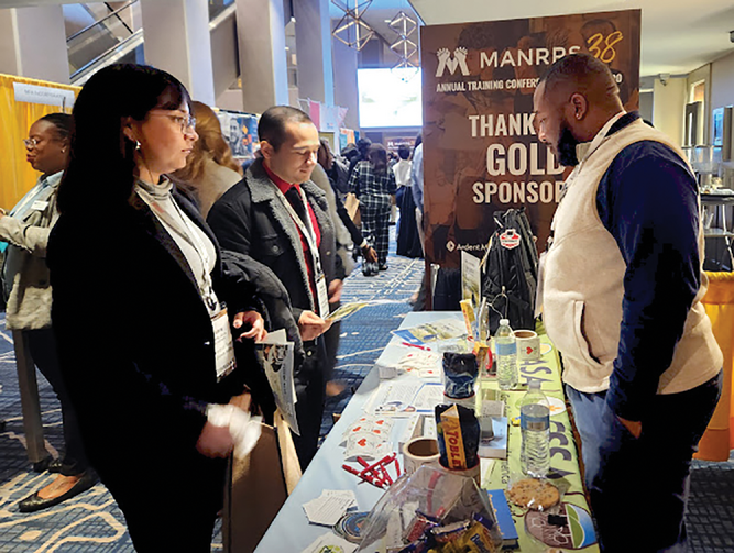 Undergraduate student member Cy’Heim McRae promotes the value of ASA, CSSA, and SSSA to attendees of the Minorities in Agriculture, Natural Resources, and Related Sciences (MANRRS) Career Fair. Photo by Sara Uttech.