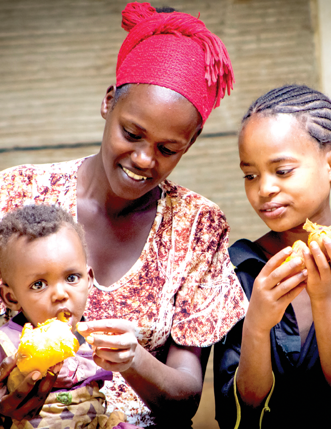 Demonstrating different ways of cooking and baking with orange-fleshed sweet potato (OFSP) at community events helps people realize they can do it at home. Photo by Frezer Asfaw.