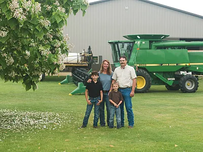 Traci Bultemeier with her family on their farm, Wayne Trace Farms, near Fort Wayne, IN. Pictured are Traci, her husband Jamie, and their boys Wyatt (now 13) and Luke (8).