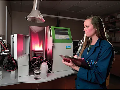 Analyses need to be accurate and precise as done by trained, professional personnel in a laboratory with excellent quality assurance/quality control. Pictured here is Rachel Buck, Laboratory Manager of the BYU Environmental Analytical Laboratory, using an atomic adsorption spectrophotometer for soil analysis. Source: BYU Photography.