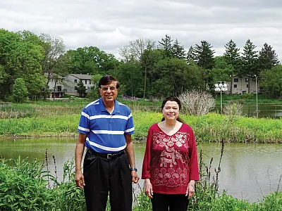 Gurdip and Dorothy Brar near one of the retention ponds of the Tiedemans Pond conservation area. This kettle pond was one Brar helped remediate, even before becoming mayor. It is home to sandhill cranes, purple martins, and many other plant and animal species. Photo by S.V. Fisk.