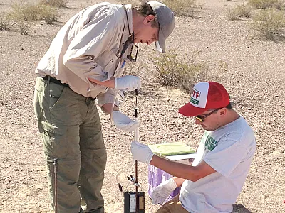 Opposite page: Brian Andraski and Stephen Maples set up unsaturated zone gas sampling equipment south of the low-level radioactive waste and hazardous waste facility. Photo courtesy of James Thordsen.