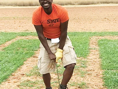 Lead author, Christopher Gillespie, soil sampling a high-acidity plot. Photo by Hailin Zhang.