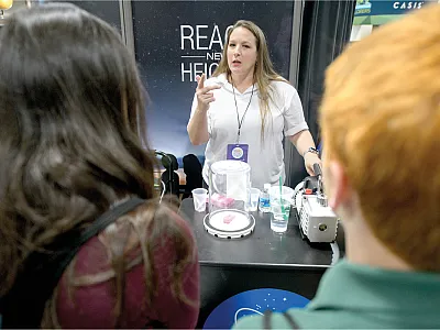 If you are fortunate enough to have colleagues who enjoy communicating science to the public, then be sure to include them in your proposals and acknowledge their efforts. Photo by NASA/Joel Kowsky.