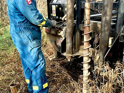 Field technician from Alberta Agriculture and Forestry decommissioning groundwater wells at a CFO site. Photo courtesy of the Government of Alberta.