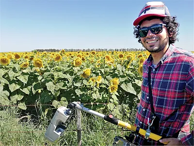 First author Sergio Tovar Hernández in an experimental field measuring normalized difference vegetation index (NDVI).