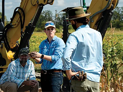 First author Dianna Bagnall (center) talks about soil structure with a field supervisor and plant scientist. Photo by Bill Stutz.