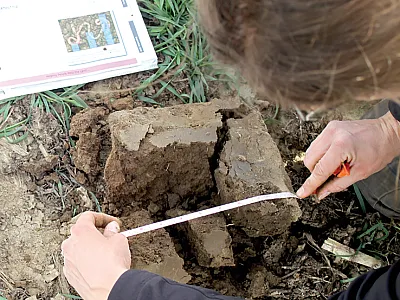 Researcher Kristen Brennan performs a visual assessment of soil structure in the field. Photo by Ann Journey.