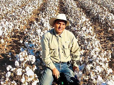 Lead author Krishna Bhandari in a Texas cotton field that was part of the study. Photo by Veronica Acosta-Martinez, USDA-ARS.