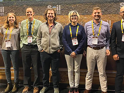 Student group photo at the SSSA booth. Photo by Fatemeh Izaditame.