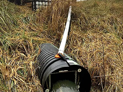 A tile drain outlet in Ohio where USDA-ARS scientists measure wa- ter quality. Photo by Jed Stinner, USDA-ARS.