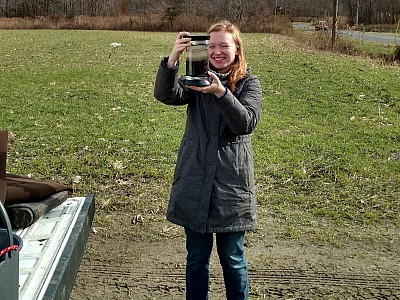 Jessica M. Anton, first author of the study, collecting sediment for isotope analyses. Photo courtesy of Deb Jaisi, University of Delaware.