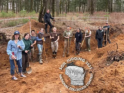 Students from University of Wisconsin–Stevens Point helping with final soil pit preparations at the 2025 National Collegiate Soil Judging Contest.