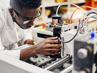 Scientist with lab machine. 