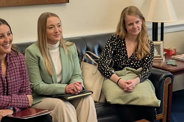 A group of women advocate for science with a Congressional staffer